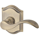 Baldwin Reserve ENCURRTAR049 Entry Right Hand Curve Lever and Traditional Arch Rose with 6AL Latch and Dual Strike Matte Brass and Black Finish - Right Hand - Brass
